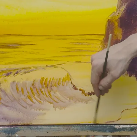 Lesson 1: Dan outlining the curl of the wave in a few loose strokes over the glowing yellow sunset wash