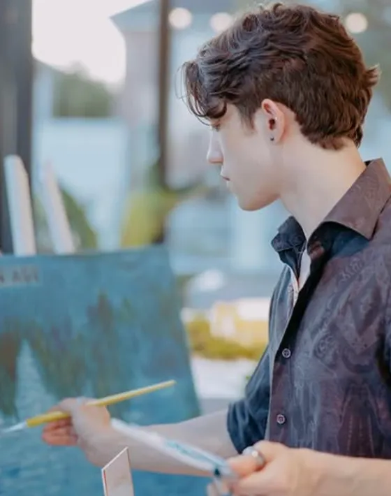 Dan, the artist and instructor, painting at an easel